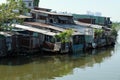 Riverside slum, houses near polluted river