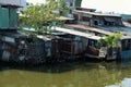 Riverside slum, houses near polluted river