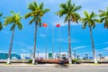 Riverside street with palm trees and motorcycle blurred in motion in Da Nang City, Vietnam