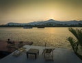 Riverside sunset view in kampot cambodia asia with deck chairs