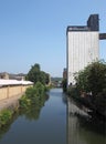 Riverside view of brighouse town with the former sugdens flour mill and grain silo now a large outdoor climbing wall and adventure