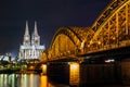 Cologne Cathedral and railway bridge over the Rhine river, Germany Royalty Free Stock Photo