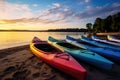 riverside view of colorful kayaks on the shore of a misty lake Royalty Free Stock Photo