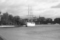 Riverside view with sailboat moored next to a park in Stockholm