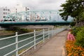 Riverside walkway near Saigawa - Ohashi iron bridge over the Sai river. Kanazawa. Japan