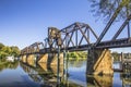 Riverwalk Old functioning train bridge over the Savannah river side view Royalty Free Stock Photo