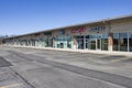 RIVERWOODS, IL - APRIL 5, 2020: An empty strip mall with a variety of stores depicts the results of social distancing and home