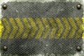 Rivet with black grille on metal plate and yellow line painted. Royalty Free Stock Photo