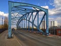 Riveted steel arch of old road bridge over railway Royalty Free Stock Photo