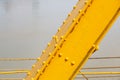 A rivetted steel girder of Papar Railway Bridge, painted yellow
