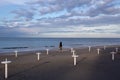 Riviera Romagnola beach near Rimini and Riccione, with typical umbrella supports; nobody; desolation mood Royalty Free Stock Photo