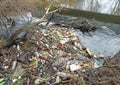 RIVNE, UKRAINE - DECEMBER, 2019: Trash in the nature. Bottles near the river. Pollution of environment