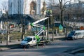 RIVNE, UKRAINE - FEBRUARY 16, 2023. A team of electricians are repairing a street lamp. Replacing lamps on a street lamp