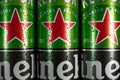 RIVNE  UKRAINE - JANUARY 12  2021: Heineken beer cans close up. Heineken Dutch brewing company. Heineken beer global brand Royalty Free Stock Photo