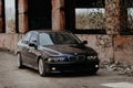 Rivne, Ukraine - September 26, 2019: BMW 5 series e39 at the old industrial building. Royalty Free Stock Photo