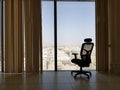 Riyadh city in Saudi Arabia as seen from the glass and the vertical blinds