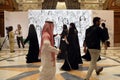 Riyadh, Saudi Arabia â 10 SEP 2024: Delegates walk past an AI-generated art work at the GAIN AI summit in Riyadh Royalty Free Stock Photo