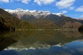 Riza lake, yellow autumn-green forest and white snow peaks Royalty Free Stock Photo