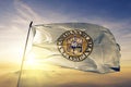 Rizal province of Philippines flag textile cloth fabric waving on the top sunrise mist fog