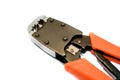 Rj45 network crimper close up with red handles on white isolated background. Copy space. Royalty Free Stock Photo