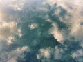 Reflecrion of sky clouds on the water of a river Royalty Free Stock Photo