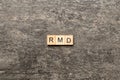 RMD word written on wood block. Required Minimum Distributions text on table, concept Royalty Free Stock Photo