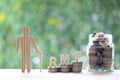 RMF - Retirement Mutual Fund, Senior man with RMF word and stack of coins money in glass bottle on natural green background, Save