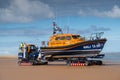 The RNLI Lifeboat stationed in Wells next the Sea, North Norfolk, UK being towed out to sea