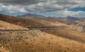 Road across the Fuerteventura landscape Royalty Free Stock Photo