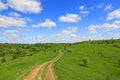 Road across green hill Royalty Free Stock Photo