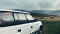 Road adventure concept. Car standing near tents on a camping in Royalty Free Stock Photo