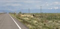 On the road again in Colorado with rocky mountains in the horizon Royalty Free Stock Photo