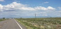 On the road again in Colorado with rocky mountains in the horizon Royalty Free Stock Photo