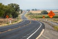 On the road again curved road with construction signs Royalty Free Stock Photo