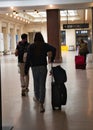 On the road again . Travelers on the move at train station