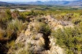 A road against a hill that was destroyed by water erosion on a farm near Worcester, Breede River Valley, South Africa Royalty Free Stock Photo