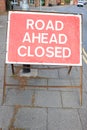 Road Ahead Closed Red sign on Pavement UK Royalty Free Stock Photo