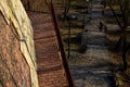 Road along the baroque bastion. modern railing made of corten sheet metal. The sidewalk is paved with burnt bricks. the high wall