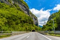 Road among Alps mountains with a toonel in a rock, Klosters-Serneus, Davos, Graubuenden Switzerland Royalty Free Stock Photo