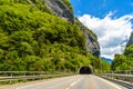 Road among Alps mountains with a toonel in a rock, Klosters-Serneus, Davos, Graubuenden Switzerland Royalty Free Stock Photo