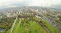 Road, aqueduct and park in city at cloudy day. Royalty Free Stock Photo