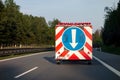 The road assistance and construction vehicle with a traffic sign controlling the traffic situation in Czech Republic Royalty Free Stock Photo