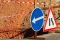 Road atention signs near the trench on the road. Royalty Free Stock Photo