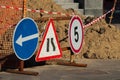 Road atention signs near the trench on the road. Royalty Free Stock Photo