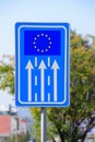 Road banner, sign with arrows directing to the EU flag