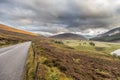 Road through beautiful landscape of cairngorms national park in