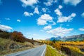 Road among the beautiful nature of the mountain and lake in Autumn on a sunny day. I Royalty Free Stock Photo