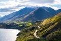 Road among the beautiful nature of the mountain and lake in Autumn on a sunny day. I Royalty Free Stock Photo