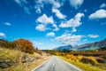 Road among the beautiful nature of the mountain and lake in Autumn on a sunny day. I Royalty Free Stock Photo