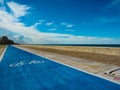 Road for bicycles by the sea on a clear day